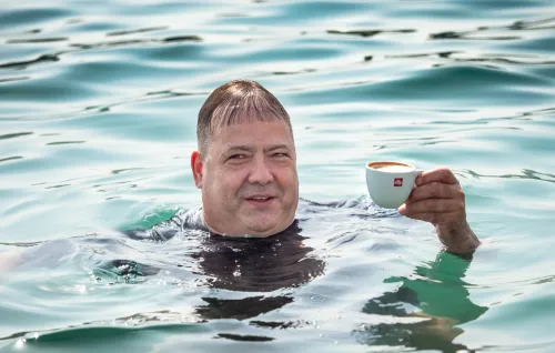 Esteemed Greg, one of the main organizers, is currently enjoying his morning coffee.